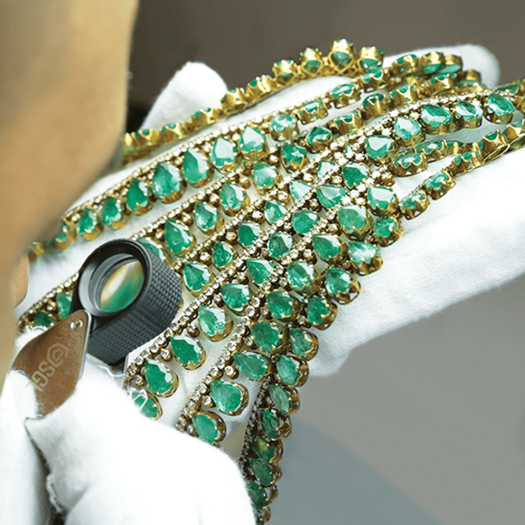 SGL Lab's gemologists grading - salada necklace studded with emeralds and diamonds